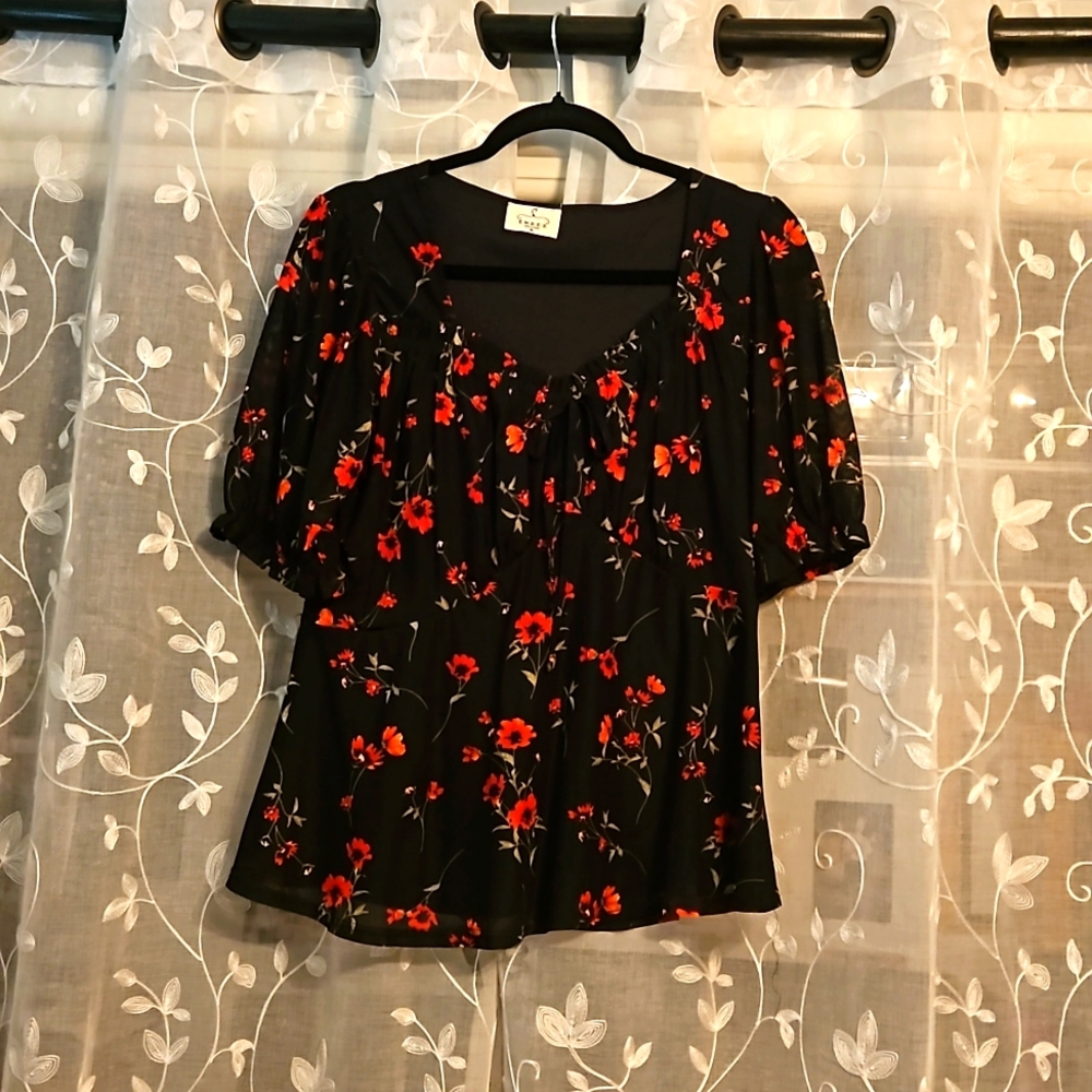 Black top with red floral pattern